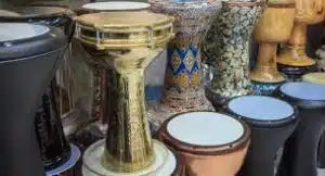 a group of different colored drums