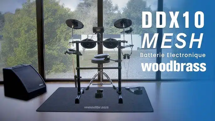 a drum set in a room Woodbrass DDX10-MESH leguidedesbatteurs.com