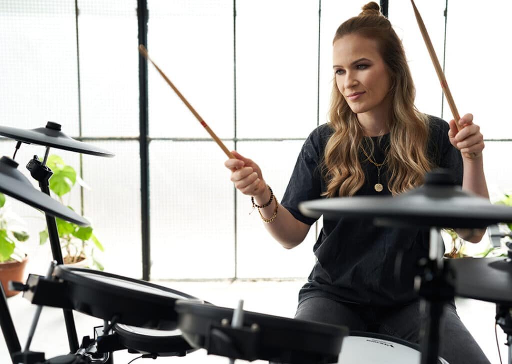 a woman playing drums
Roland TD-17KVX2
