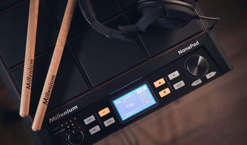 a electronic device with buttons and buttons and a drum stick millenium nonapad leguidedesbatteurs.com