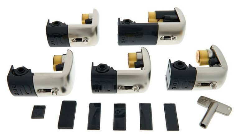 Contenu du set 2box TrigIt : 5 triggers, 6 patins noirs et une clé de batterie